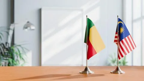 FLAGS OF BENIN AND MALAYSIA ON TABLE Stock Photos