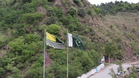 Flags beside hillside Stock Footage 336900407