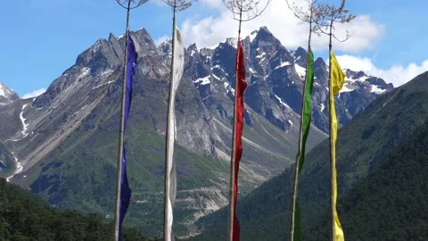 Flags blowing in front of Himalayan Mountain Stock Footage 139231563