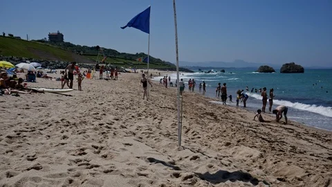 Flags blowing in the wind, on a beach 스톡 동영상 112182781