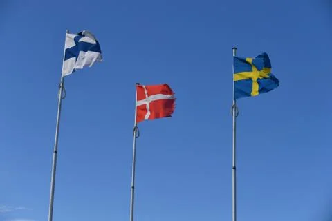 Flags in blue sky Stock Photos