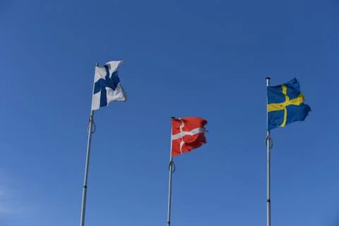 Flags in blue sky Stock Photos
