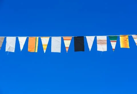Flags in the blue sky Stock Photos
