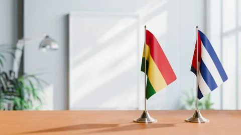 FLAGS OF BOLIVIA AND CUBA ON TABLE Stock Photos