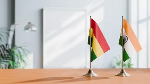 FLAGS OF BOLIVIA AND INDIA ON TABLE Stock Photos