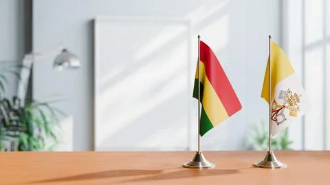 FLAGS OF BOLIVIA AND VATICAN ON TABLE Stock Photos