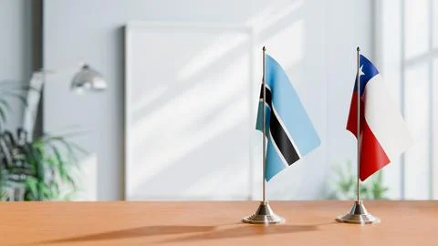 FLAGS OF BOTSWANA AND CHILE ON TABLE Stock Photos