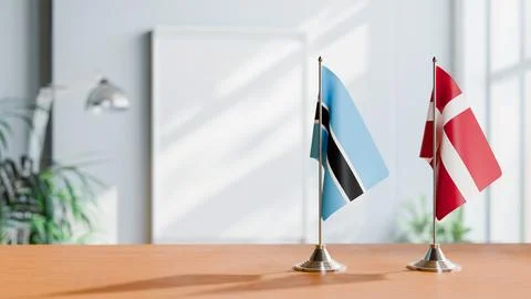 FLAGS OF BOTSWANA AND DENMARK ON TABLE Stock Photos