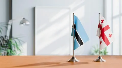FLAGS OF BOTSWANA AND GEORGIA ON TABLE Stock Photos