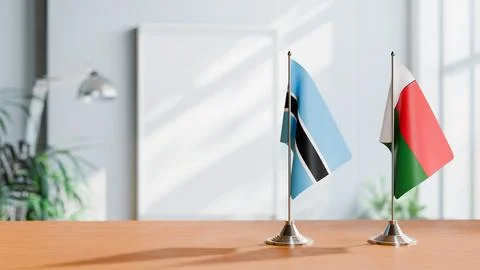 FLAGS OF BOTSWANA AND MADAGASCAR ON TABLE Stock Photos