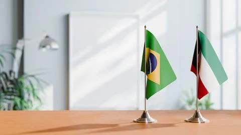 FLAGS OF BRAZIL AND KUWAIT ON TABLE Stock Photos