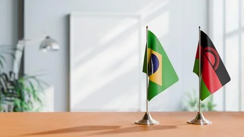 FLAGS OF BRAZIL AND MALAWI ON TABLE Stock Photos
