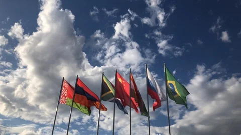 Flags Of BRICS Countries Waving in the Wind Against Blue Sky Vídeos de archivo 109461262