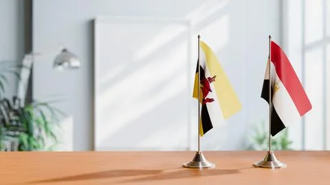 FLAGS OF BRUNEI AND EGYPT ON TABLE Stock Photos
