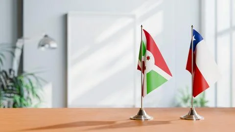 FLAGS OF BURUNDI AND CHILE ON TABLE Stock Photos