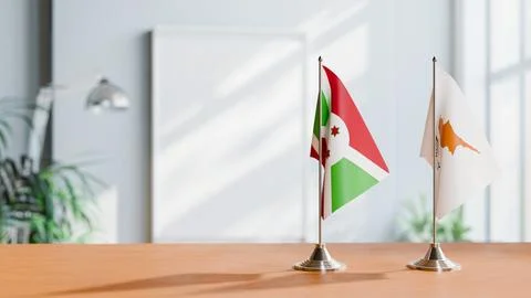 FLAGS OF BURUNDI AND CYPRUS ON TABLE Stock Photos