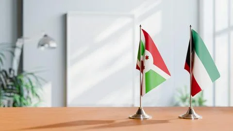 FLAGS OF BURUNDI AND KUWAIT ON TABLE Stock Photos