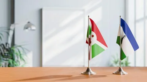 FLAGS OF BURUNDI AND LESOTHO ON TABLE Stock Photos