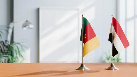 FLAGS OF CAMEROON AND EGYPT ON TABLE Stock Photos