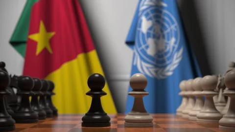 Flags of Cameroon and United Nations behind pawns on the chessboard. Conceptual Stock Illustration