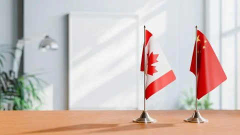 FLAGS OF CANADA AND CHINA ON TABLE Stock Photos