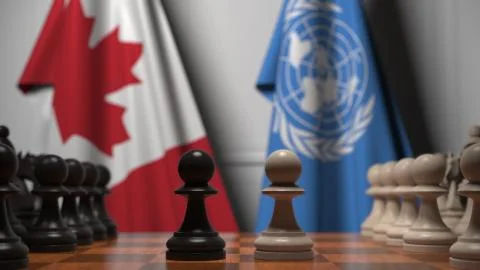 Flags of Canada and United Nations behind pawns on the chessboard. Chess game or Stock Illustration