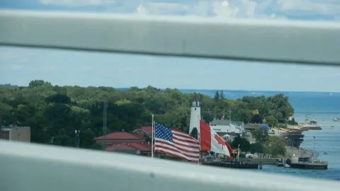 Flags of Canada and USA Visible at Border Crossing Bridge Stock Footage 316611661