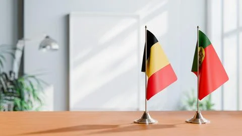 FLAGS OF CHAD AND PORTUGAL ON TABLE Stock Photos
