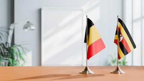 FLAGS OF CHAD AND UGANDA ON TABLE Stock Photos