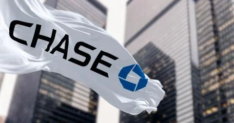 Flags of Chase Bank waving in the wind in a financial district Stock Illustration