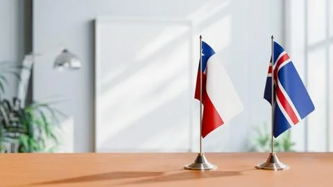 FLAGS OF CHILE AND ICELAND ON TABLE Stock Photos