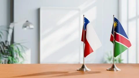 FLAGS OF CHILE AND NAMIBIA ON TABLE Stock Photos