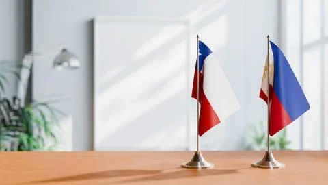 FLAGS OF CHILE AND PHILIPPINES ON TABLE Stock Photos