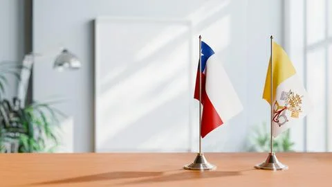 FLAGS OF CHILE AND VATICAN ON TABLE Stock Photos
