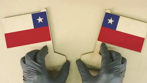 Flags of Chile made of recycled paper on the cardboard table Stock Footage 143259931