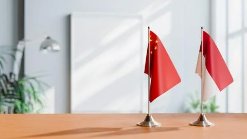 FLAGS OF CHINA AND INDONESIA ON TABLE Stock Photos