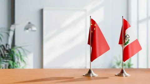FLAGS OF CHINA AND PERU ON TABLE Stock Photos