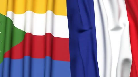 Flags of COMOROS and FRANCE with realistic cloth texture Stock Photos