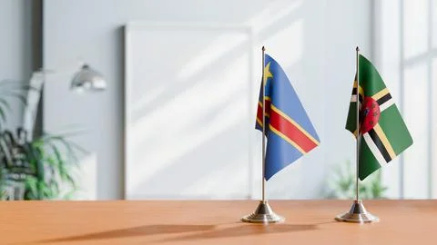 FLAGS OF CONGO DEMOCRATIC REPUBLIC AND DOMINICA ON TABLE Stock Photos