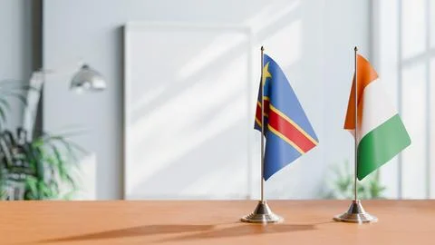 FLAGS OF CONGO DEMOCRATIC REPUBLIC AND IVORY COAST ON TABLE Stock Photos