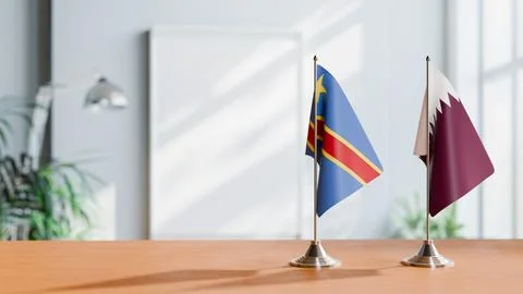FLAGS OF CONGO DEMOCRATIC REPUBLIC AND QATAR ON TABLE Stock Photos