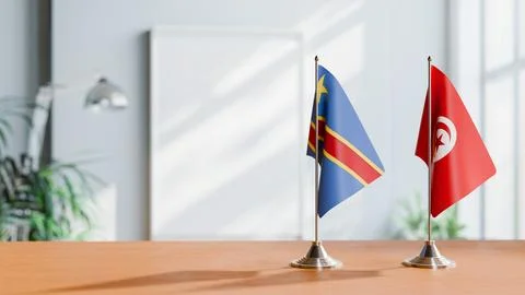 FLAGS OF CONGO DEMOCRATIC REPUBLIC AND TUNISIA ON TABLE Stock Photos