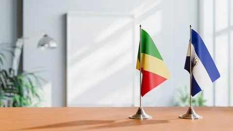 FLAGS OF CONGO R AND EL SALVADOR ON TABLE Stock Photos