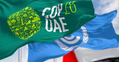 Flags of COP28, UNFCCC and UAE waving on a clear day. Stock Illustration