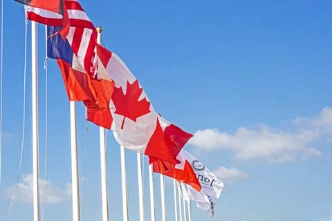Flags of countries and regions on a sunny day Stock Photos