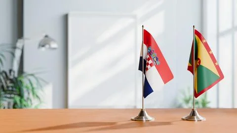 FLAGS OF CROATIA AND GRENADA ON TABLE Stock Photos