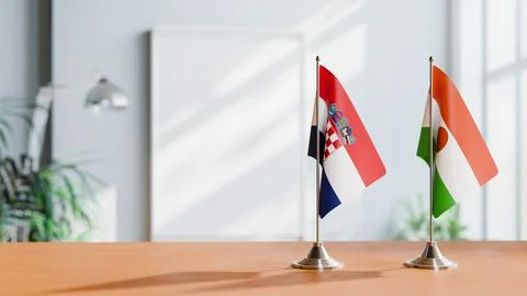 FLAGS OF CROATIA AND NIGER ON TABLE Stock Photos