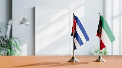 FLAGS OF CUBA AND KUWAIT ON TABLE Stock Photos