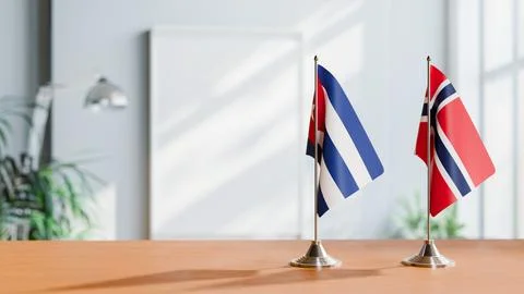 FLAGS OF CUBA AND NORWAY ON TABLE Stock Photos
