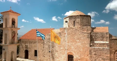 Flags of Cyprus and Greece on the flagpole near the church Stock Footage 127762032